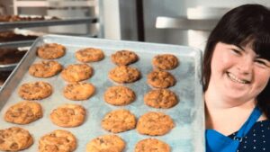 woman with down syndrome baking cookies